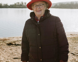 Shirley Davis, Combermere, age 83. Shirley is a proud Red Hatter from Combermere.
Here she is photographed at the lakeshore in Barry’s Bay. “Good friends and a Red Hat, life don’t get much better than that!” —Anon