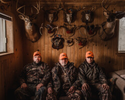 Carl Kuehl, Killaloe, age 74. Carl sits with his son Jeff and grandson Dylan at the family hunt camp near Killaloe. Hunting is a long-standing family
tradition, passed down from generation to generation.