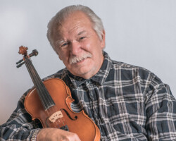 Donnie Palubeskie, Barry’s Bay, age 75. Donnie is a long-time Barry’s Bay business owner, fiddle player and music teacher.