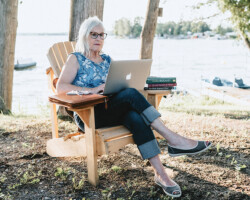 Johanna Zomers, Eganville, age 68. Johanna sits at Lake Dore and enjoys some quiet time writing. Joanna is a local author and also writes for the Eganville Leader.