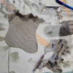 Clay rolled out with patterns.