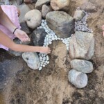 Large and small stones laid out in a pattern.