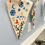 Painted pennants hang on a string.