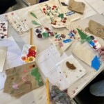 Painted canvas and art supplies on a table.